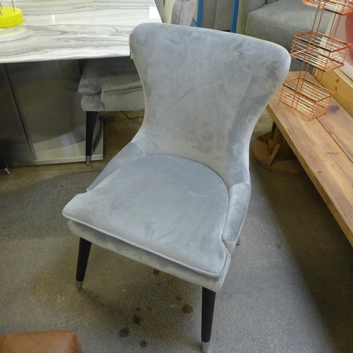 1593 - A set of four grey velvet dining chairs * this lot is subject to VAT