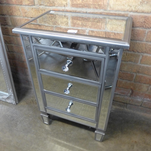 1607 - A three drawer silver mirrored bedside chest