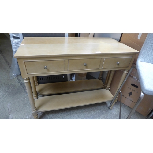 1642 - A pair of three drawer gold effect console tables