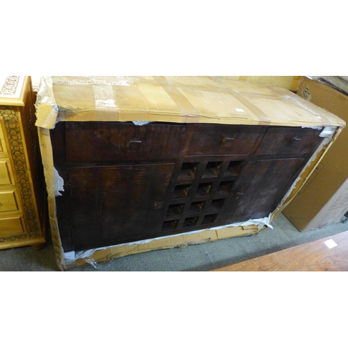 1647 - A hardwood three drawer, two door wine rack sideboard * this lot is subject to VAT