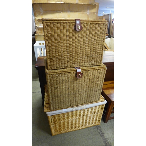 1650 - A pair of wicker baskets and a bamboo style basket