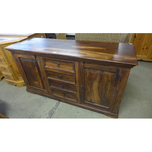 1656 - A hardwood three drawer, two door sideboard * this lot is subject to VAT