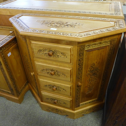 1657 - A pine carved two door, four drawer sideboard