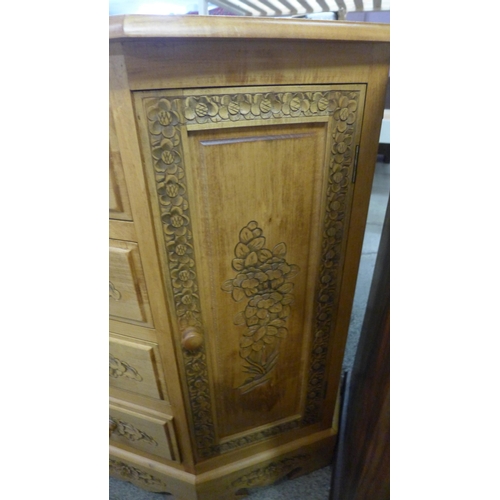 1657 - A pine carved two door, four drawer sideboard