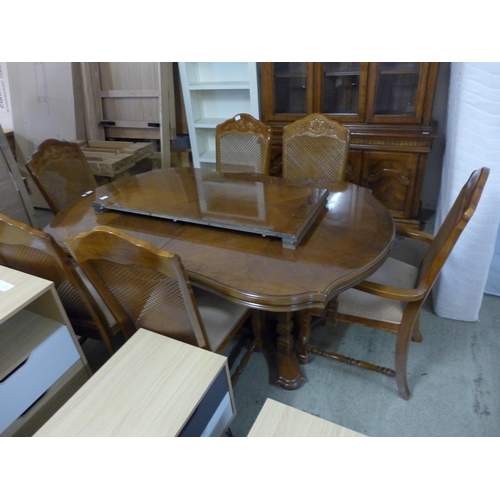 1709 - A French style elm and hardwood dining suite, comprising extending table, 6 chairs including 2 carve... 