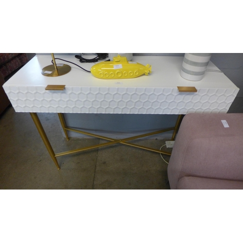 1313 - A white console table with gold cross legs