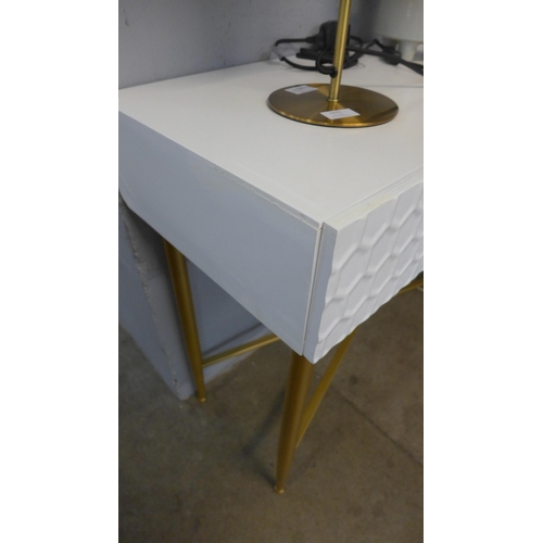 1313 - A white console table with gold cross legs