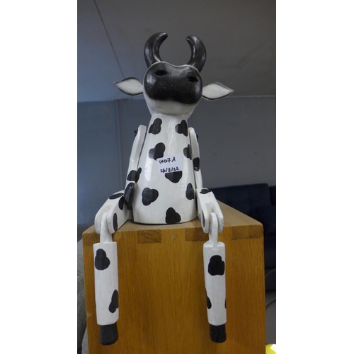 1407a - An articulated sitting Friesian cow, H 31cms (AR01614)   #