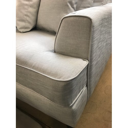 1560 - A Chatsworth-flex straw silver upholstered three and four seater sofas