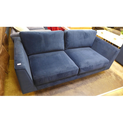 1354 - A blue velvet three seater sofa