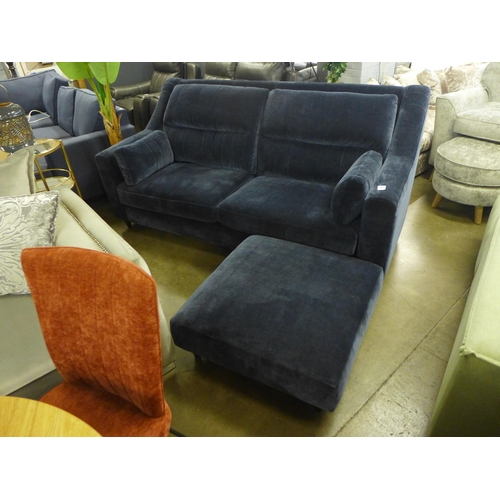 1426 - A midnight blue velvet, high back three seater sofa and footstool