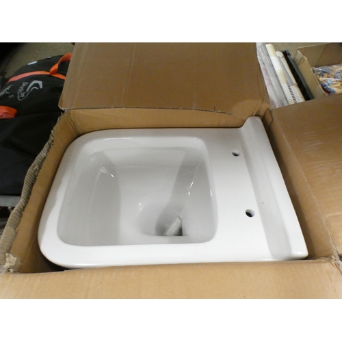 2079 - Ceramic toilet and seat, boxed, unused