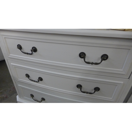 1432 - A white three drawer chest