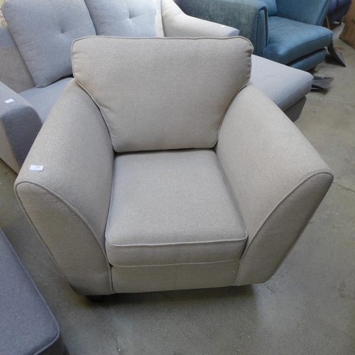 1493 - An oatmeal upholstered armchair