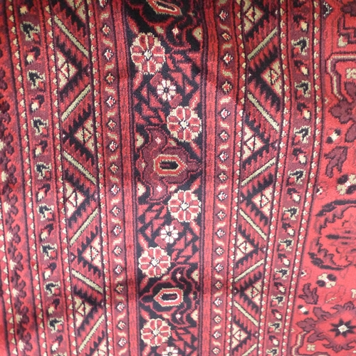 1500 - A rich red ground large Afghan carpet, all over design, 350 x 250cm