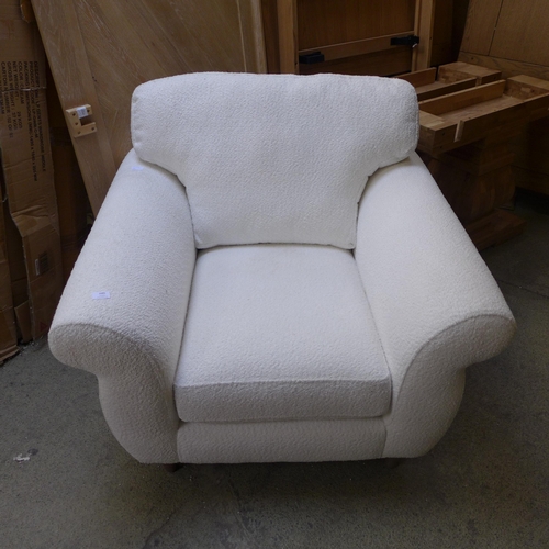 1560 - A white upholstered armchair