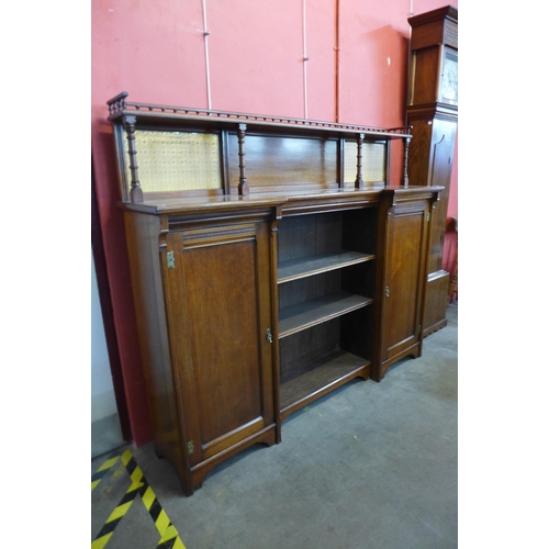 27 - A Victorian Aesthetic Movement walnut breakfront bookcase