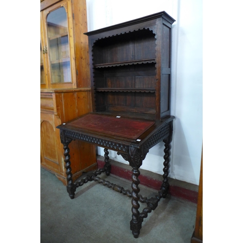 107 - A 19th Century French carved oak barleytwist writing table/bookcase