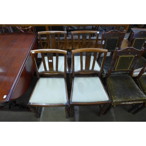 169 - A set of four oak dining chairs