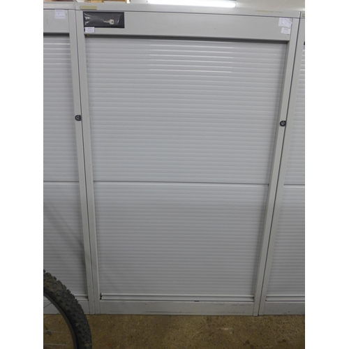 2311 - A 160cm tall Vickers metal cabinet with roller shutter door, and key