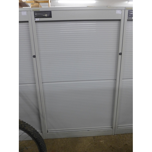 2312 - A 160cm tall Vickers metal cabinet with roller shutter door, with key