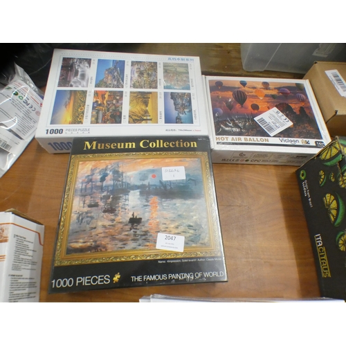 2046 - 3 Sealed 1000-piece jigsaws (German stone castle, Paris street scene and London Impressionist scene)