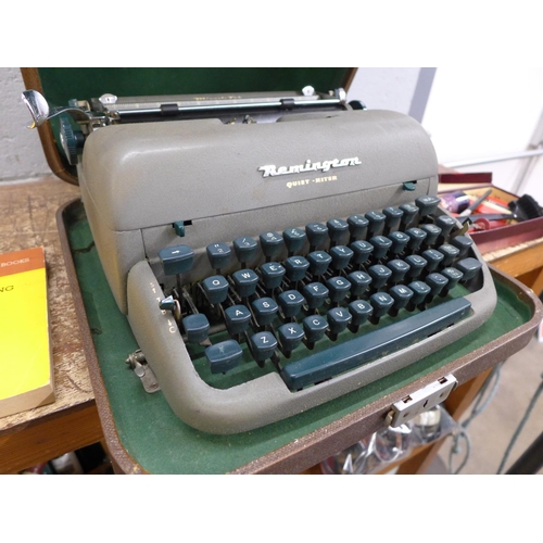 1047 - A Remington Quiet-Riter typewriter, accessories and book **PLEASE NOTE THIS LOT IS NOT ELIGIBLE FOR ... 