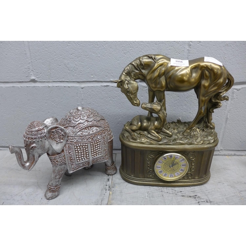 1056 - A resin mantle clock depicting a horse and foal and a model of an Indian elephant **PLEASE NOTE THIS... 