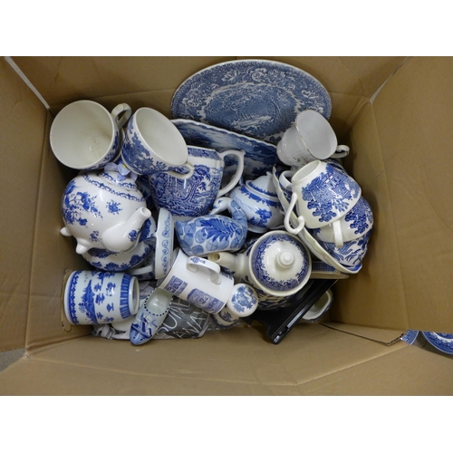 1084 - A box of blue and white china including cups, bowls, saucers and a large meat plate **PLEASE NOTE TH... 