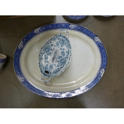 1084 - A box of blue and white china including cups, bowls, saucers and a large meat plate **PLEASE NOTE TH... 