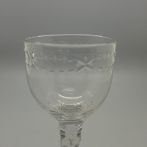 642 - A Georgian wine glass with ovoid bowl, hexagonal facted stem, conical foot with snapped pontil, circ... 