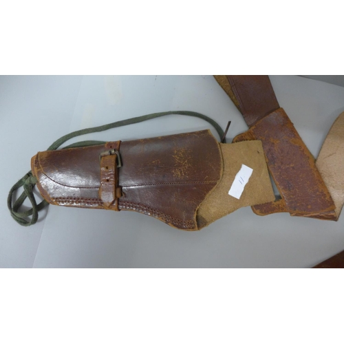 670 - A leather gun holster and belt