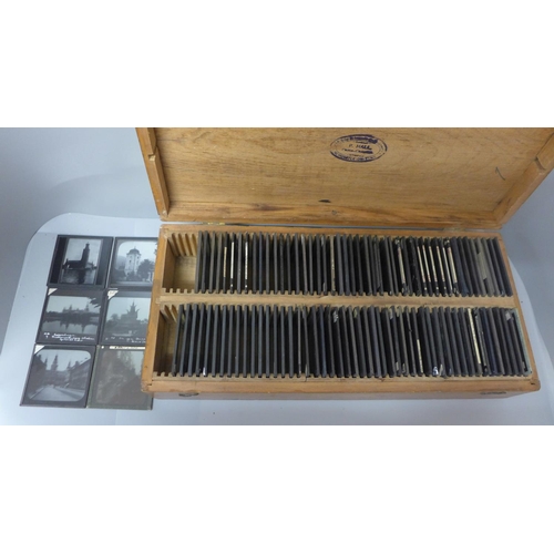 675 - A wooden case with one hundred magic lantern slides