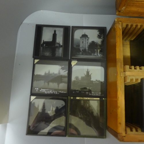 675 - A wooden case with one hundred magic lantern slides