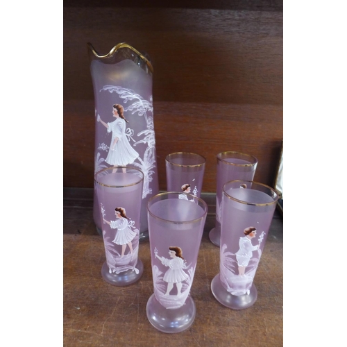 677 - A set of hand painted Mary Gregory style pink glasses and matching jug