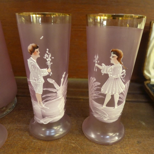 677 - A set of hand painted Mary Gregory style pink glasses and matching jug