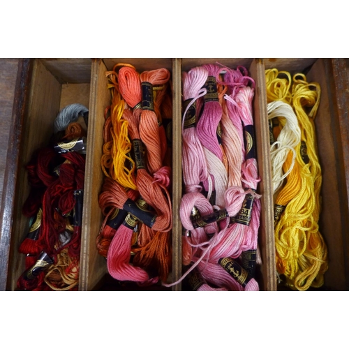 679 - A wooden embroidery box containing silks