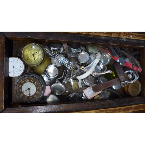 681 - Assorted clock and watch spares including a tortoiseshell mounted 8-day clock, a/f