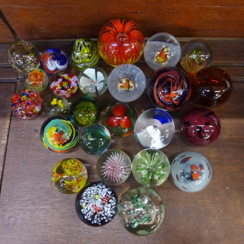 684 - A collection of twenty-six glass paperweights