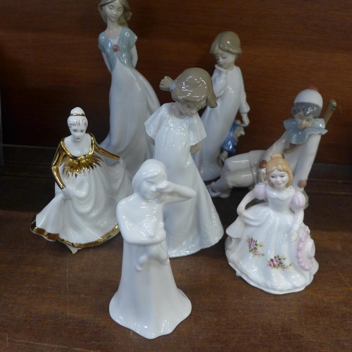 688 - Seven figures, four Nao, two Royal Doulton and Minton china