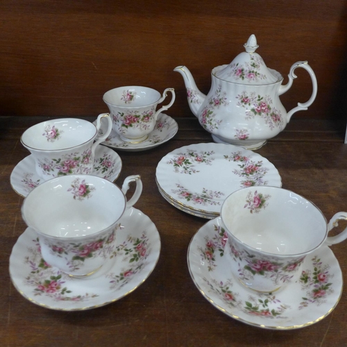 689 - A Royal Albert Lavender Rose teapot, four cups and saucers and three side plates