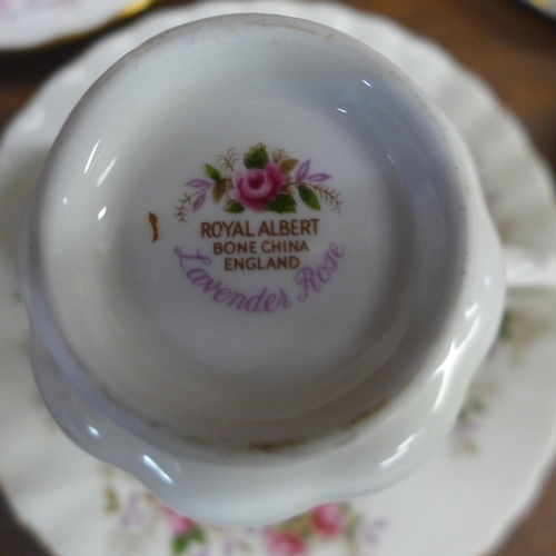 689 - A Royal Albert Lavender Rose teapot, four cups and saucers and three side plates