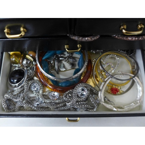 692 - A collection of costume jewellery in a jewellery box