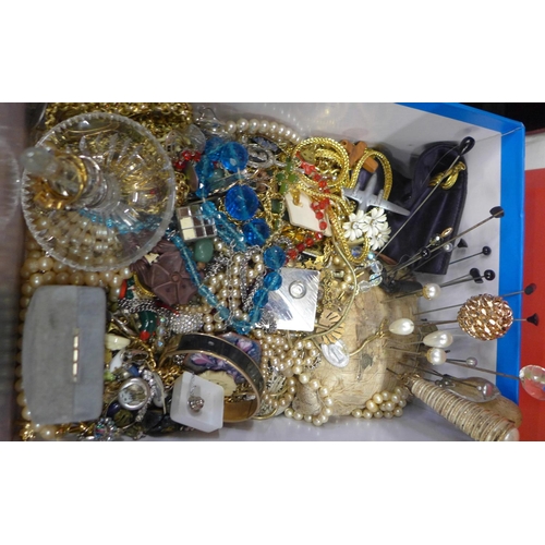 695 - A box of costume jewellery including hat pins