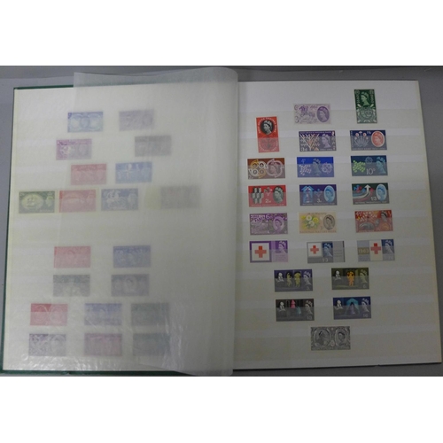 711 - Stamps:- GB mint in stockbook with George VI (all three £1 values) and Q.E. II including £20 face