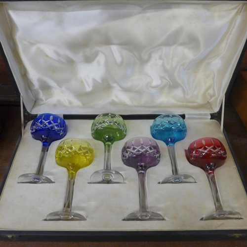 712 - Six coloured hock glasses, cased