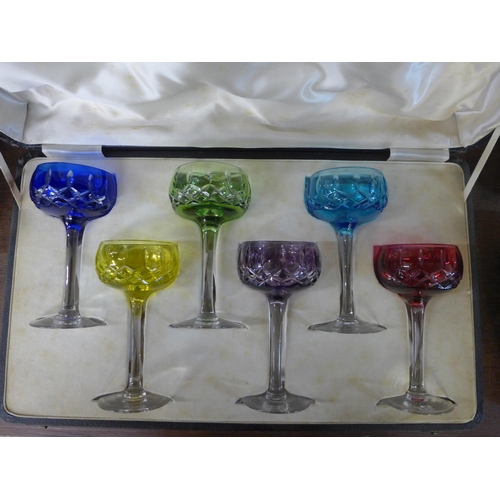 712 - Six coloured hock glasses, cased