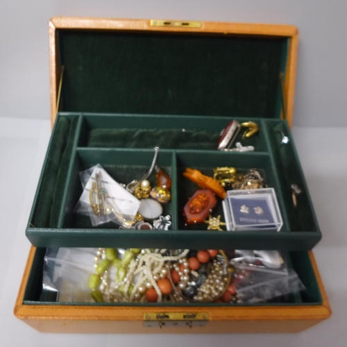 714 - A box of costume jewellery including two 9ct gold brooches, 2.9g