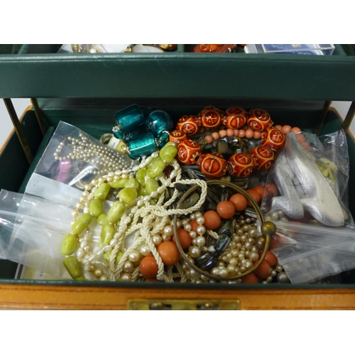 714 - A box of costume jewellery including two 9ct gold brooches, 2.9g