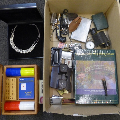 719 - A collection of items including cigarette cases, card cases, lighters, a slide viewer, a costume nec... 